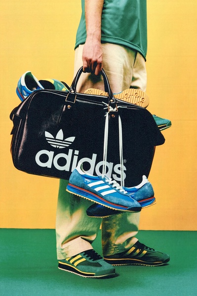 A minimalist advertisement featuring a person holding a large branded bag overflowing with multiple colorful running shoes against a split-color background.