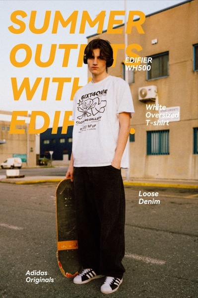 A street-style portrait of a young man wearing an oversized t-shirt, loose denim, and Edifier headphones, framing audio gear as a fashion accessory.