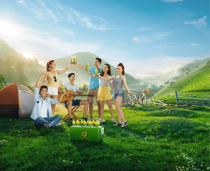 A group of friends enjoying tea during a camping trip in a scenic mountain setting, emphasizing a refreshing lifestyle appeal.
