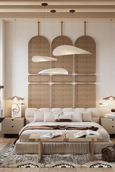 A high-end bedroom scene featuring designer hanging lamps, rattan wall panels, and a neutral, serene color palette.