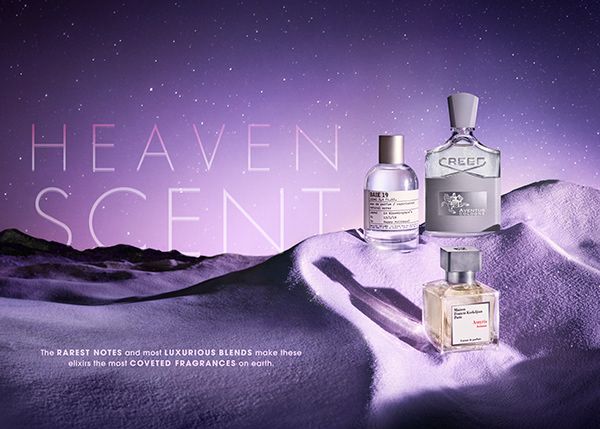 A high-end fragrance advertisement featuring three luxury perfume bottles resting on a surreal, starlit purple landscape.
