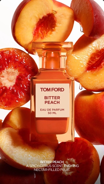 A high-end, clean-background hero shot of a perfume bottle surrounded by sliced peaches, emphasizing its core scent notes.