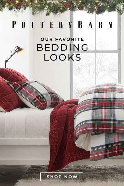 A high-end, cozy bedroom scene styled with plaid bedding and holiday accents to evoke a seasonal, comfortable mood.