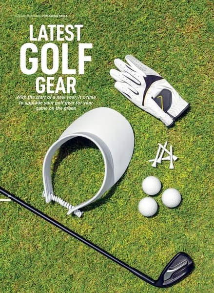 A top-down, clean flat lay composition featuring golf equipment including a glove, visor, balls, and club on a manicured green background.