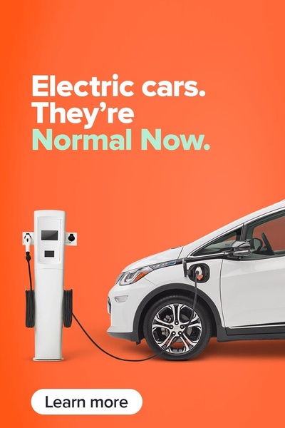 A minimalist, bold-text creative showing an electric car plugged into a charging station against a solid vibrant orange background.