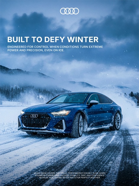 A high-performance sedan is captured driving through a snowy landscape, emphasizing engineering precision and stability in extreme winter weather conditions.