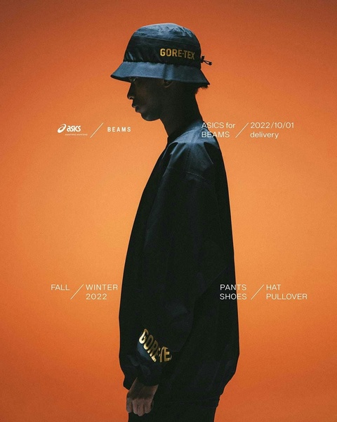 A high-fashion, silhouette-style product showcase featuring a Gore-Tex bucket hat against a vibrant, solid orange background.