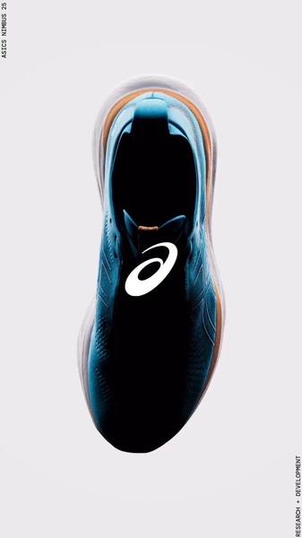 A top-down, high-contrast studio view of a running shoe that emphasizes sleek design and brand identity through negative space.