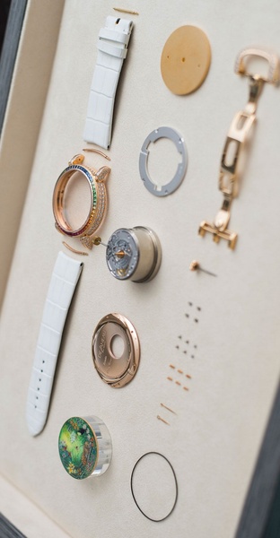 luxury watch, watch movement, watch parts, diamond watch, watch mechanism, timepiece components, product launch, brand awareness, flat lay, editorial, luxurious, trustworthy, neutral, gold
