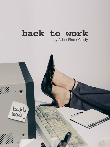 A minimalist, desk-focused shot featuring a pair of black high heels resting on a keyboard, conveying a return-to-office work theme.