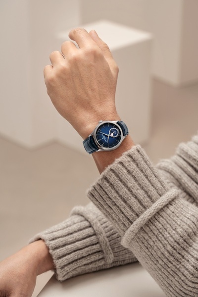 wrist watch, leather strap watch, analog watch, luxury watch, mens watch, brand awareness, lifestyle, minimalist, calm, luxurious, neutral, blue