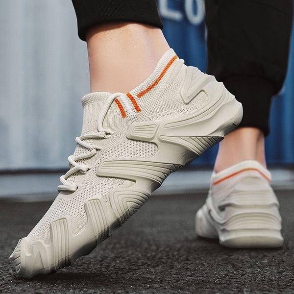 A close-up, high-angle shot focusing on the textured design and aesthetic appeal of a lightweight knit running shoe.