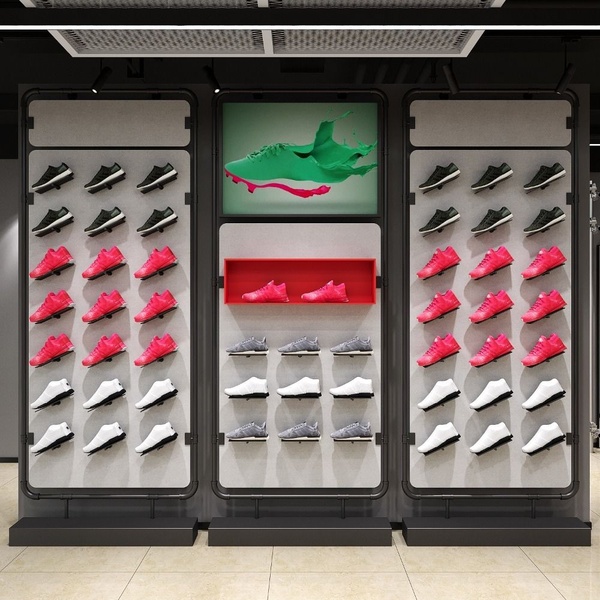 A clean, studio-lit display featuring multiple rows of running shoes organized by color, highlighting a central premium product on a digital screen.