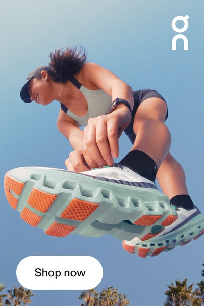 A dynamic shot of a runner from a low-angle perspective, emphasizing the technical features and design of the footwear while in motion.