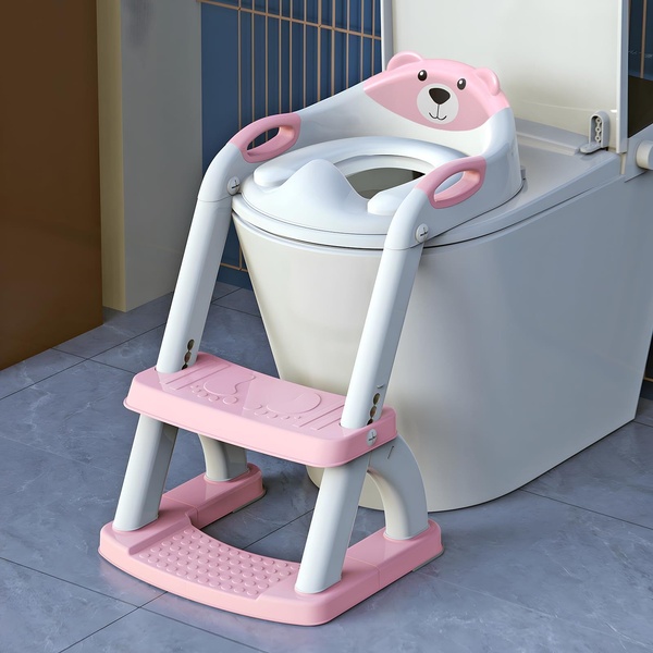 A clean, studio-lit 1:1 image of a bear-themed toddler toilet seat placed directly on an adult toilet to demonstrate easy installation and scale.