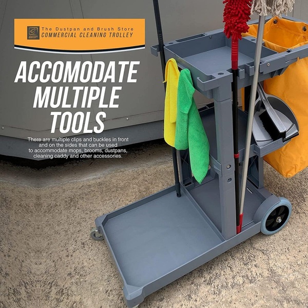 A feature-focused shot showcasing a commercial cleaning trolley with various tools attached to its hooks and clips.
