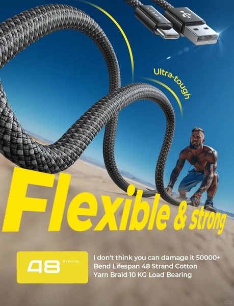 A 3:4 ratio ad displaying a USB charging cable being pulled by a muscular person in a desert setting, emphasizing its high-load capacity and bend lifespan.