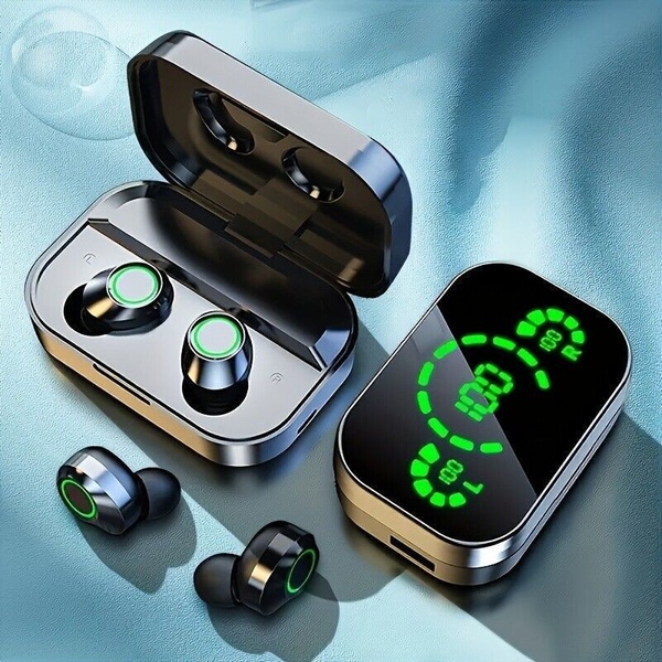 A top-down, balanced studio shot of black wireless earbuds and their charging case, featuring a high-visibility, glowing green LED charge display.