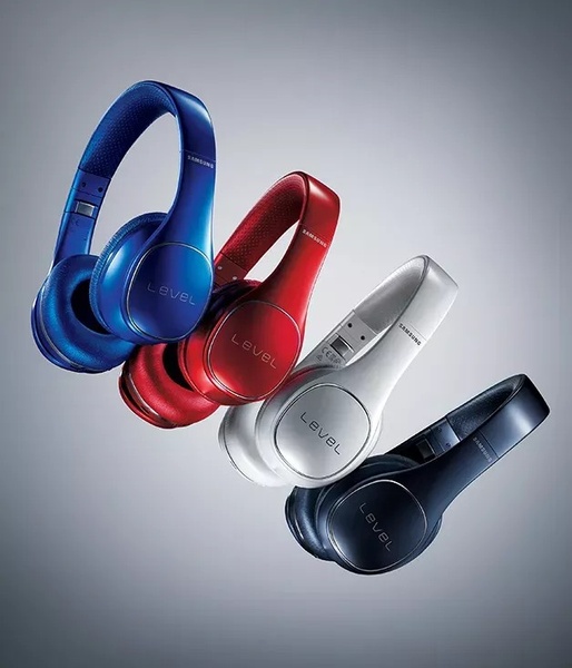 A high-contrast studio shot displaying four color variations of wireless headphones floating against a neutral gradient backdrop.