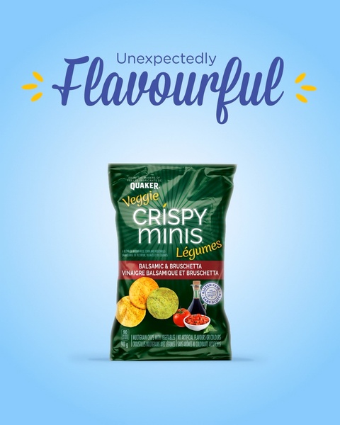 A minimalist studio shot of a green bag of veggie chips centered on a light blue background, highlighting the product with a bold text hook.