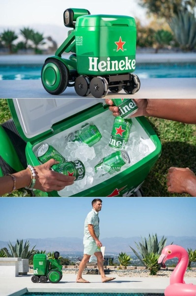 A high-end autonomous cooler follows a person by a poolside, showcasing effortless drink accessibility.