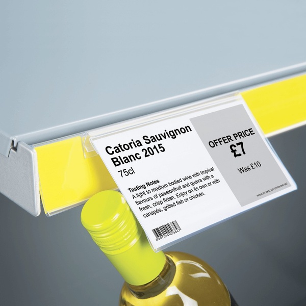 A close-up shot of a physical price tag on a retail shelf highlighting a discount on a bottle of white wine.