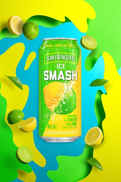 A clean, high-contrast product hero shot of a Smirnoff Ice Smash can surrounded by floating lemon and lime slices against a vibrant neon backdrop.
