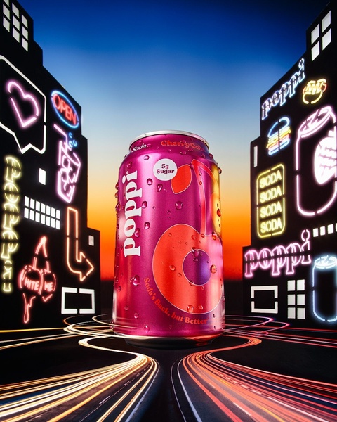A vibrant cherry soda can stands on a stylized digital road, framed by glowing neon signs in a futuristic urban setting.