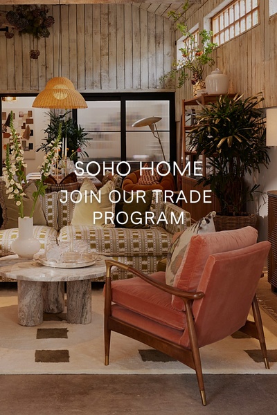 This creative showcases a premium velvet armchair in a curated, high-end interior setting to attract trade professionals.