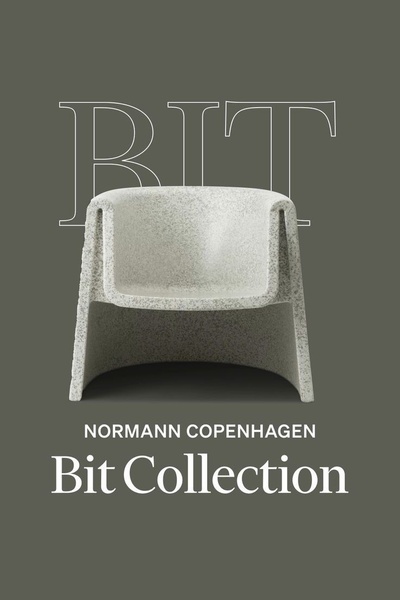 A minimalist product spotlight featuring an armchair against a muted green background with bold brand typography.