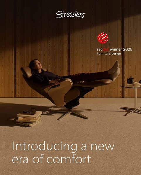 A high-end recliner chair advertisement featuring a model relaxing, highlighting comfort and design excellence in a warm, minimalist environment.