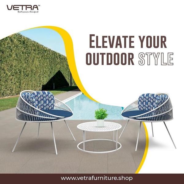 A clean, square-format ad showcasing a modern outdoor bistro set positioned against a pool background, emphasizing lifestyle appeal.