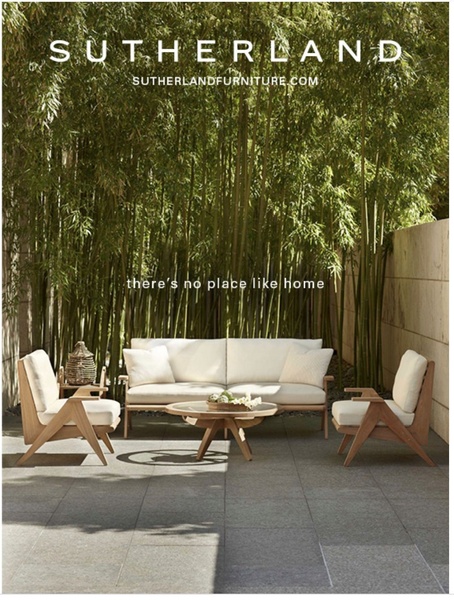 A luxury outdoor furniture set featuring a sofa, two chairs, and a coffee table positioned in a tranquil, bamboo-lined patio setting.