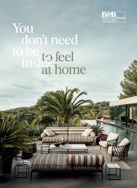 An elegant, high-end outdoor sofa set positioned poolside in a tranquil, natural environment, using minimalist typography to define a luxurious home atmosphere.