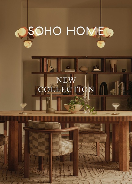 A high-end dining room set displayed in warm, moody lighting to establish a premium lifestyle aesthetic.