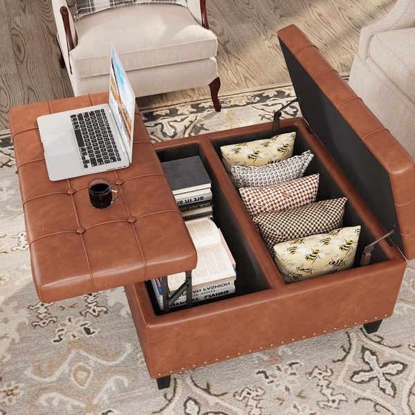 A high-angle product shot showcasing a Storage Ottoman with a lift-top workspace and interior storage compartments.