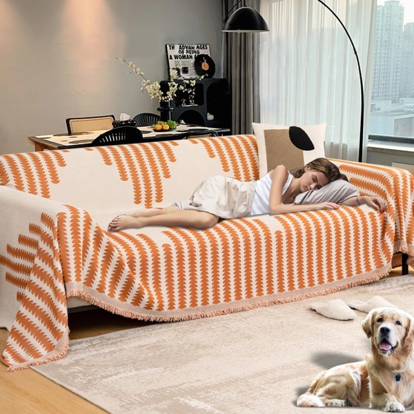 A high-conversion lifestyle advertisement for a sofa cover featuring a person sleeping comfortably on a patterned couch with a golden retriever nearby.