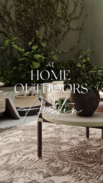 A high-end, lifestyle-focused ad for an outdoor coffee table featuring a curated patio setting with natural textures and greenery.