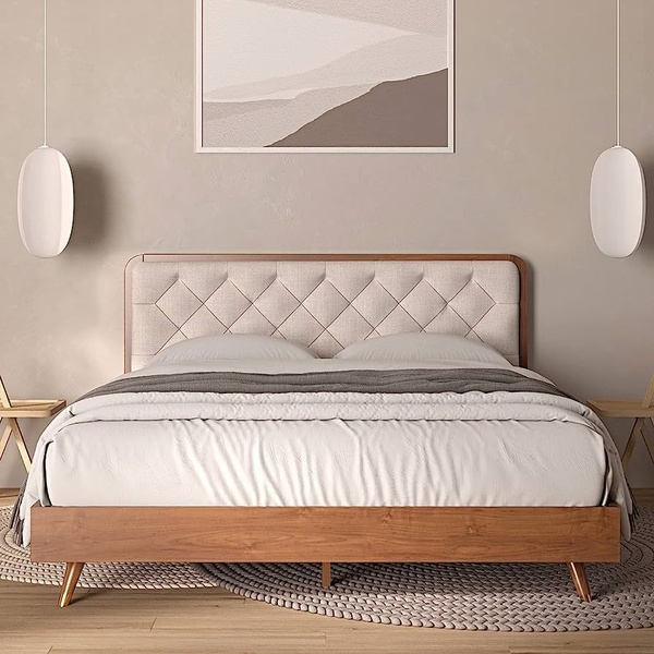 A clean, eye-level studio shot of an upholstered diamond-tufted bed featuring natural wood accents and soft ambient lighting.