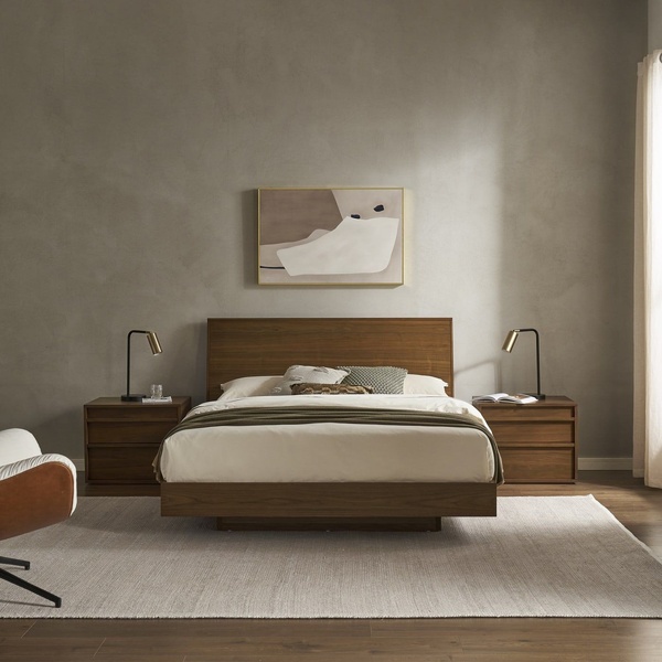 A clean, symmetrical product shot of a wooden platform bed in a neutral, modern bedroom setting.