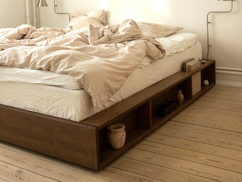 This creative showcases a wooden platform bed with integrated storage, emphasizing clean lines and natural bedroom aesthetics.