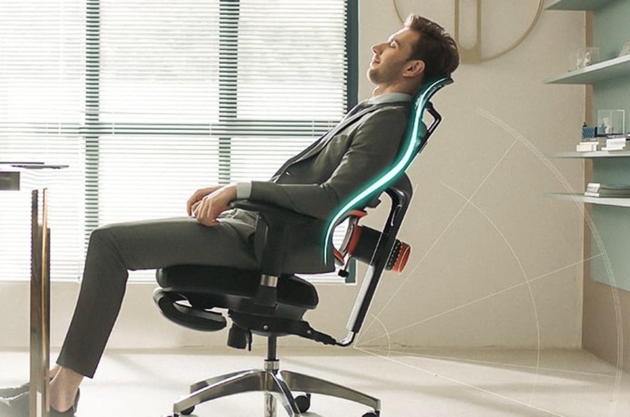 A high-quality image of a professional in a suit relaxing in an ergonomic office chair, with subtle geometric overlays indicating comfort range.