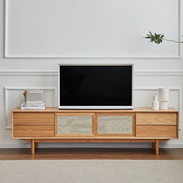 A high-fidelity product hero shot of a wooden TV console table set against a clean, architectural wall, emphasizing texture and form.