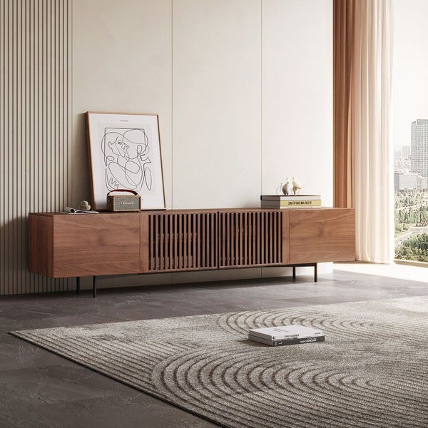 A high-end media console is showcased in a sun-drenched, minimalist living room, emphasizing clean lines and natural wood textures.