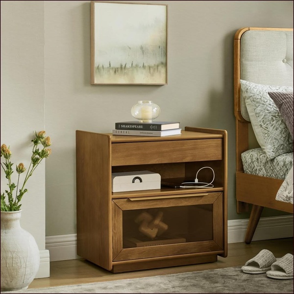 A high-quality 1:1 image featuring a wooden nightstand in a neutrally toned bedroom, emphasizing its design, storage, and utility.