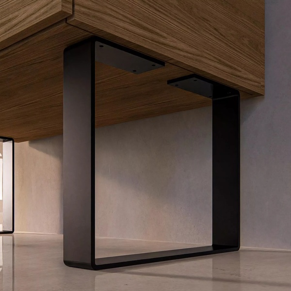 A close-up, high-detail photograph of a matte black metal table leg attached to a wooden furniture piece, emphasizing build quality and sleek aesthetics.