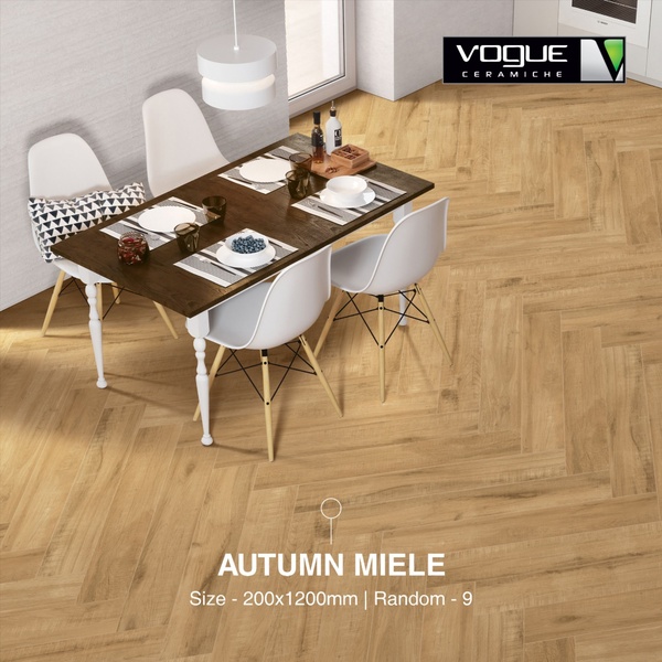A high-quality lifestyle shot featuring Autumn Miele ceramic tiles installed in a modern dining room setting.