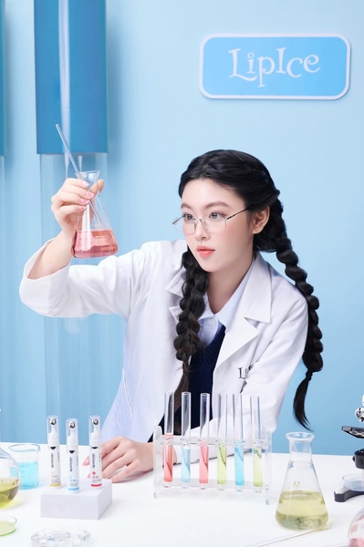 A high-authority ad creative featuring a model in a lab coat performing a test with colored liquids, visually suggesting scientific validation for a lip balm.