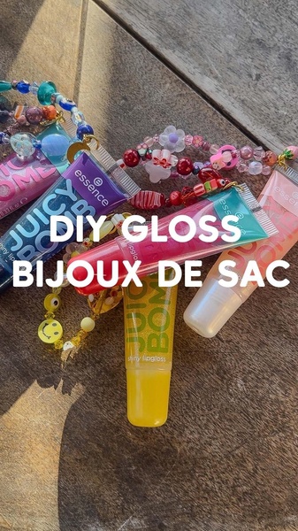 lip gloss, shiny lip gloss, lip shine, lip makeup, glossy lip product, lip color gloss, product launch, brand awareness, ugc style, flat lay, playful, energetic, pink, brown, yellow