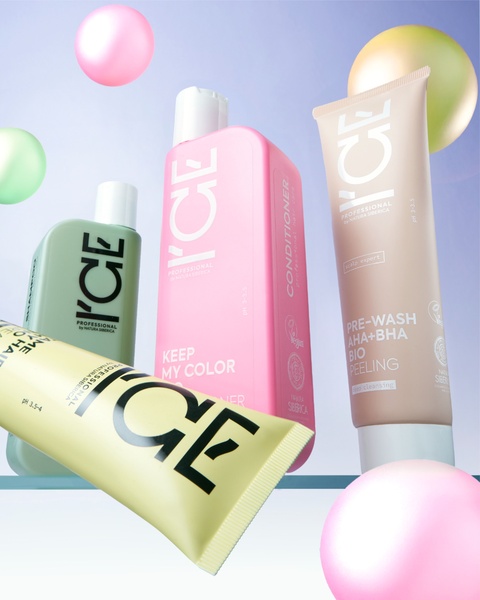 This creative displays four hair care bottles suspended in mid-air against a soft gradient background with abstract floating spheres, emphasizing a clean and professional aesthetic.